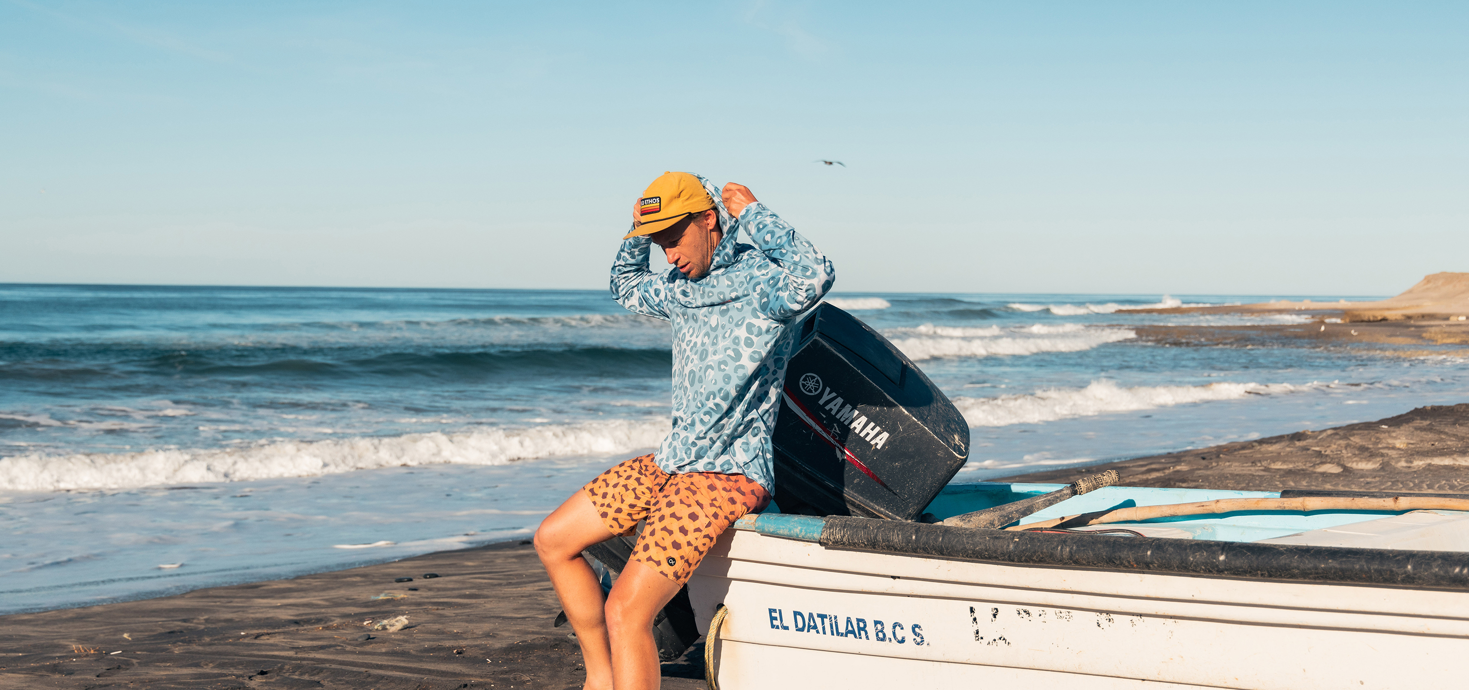 Field Ethos: Shop all products. Photo focuses on an old Yamaha motorcycle with a Field Ethos sticker on the tank.